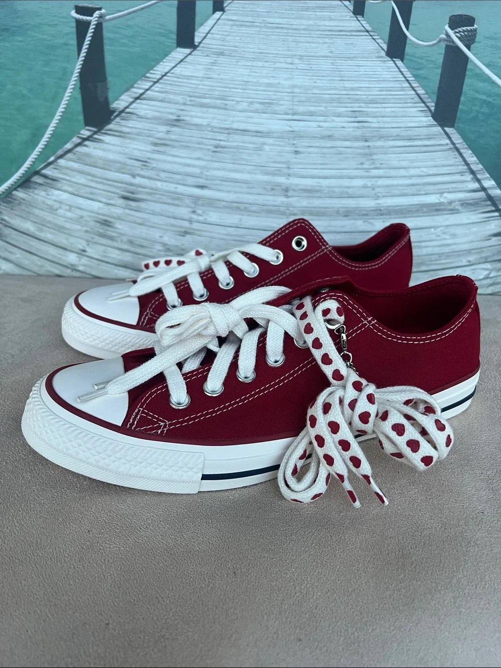 Converse Women's Low Top Sneakers in Burgundy with Heart-Print Laces
